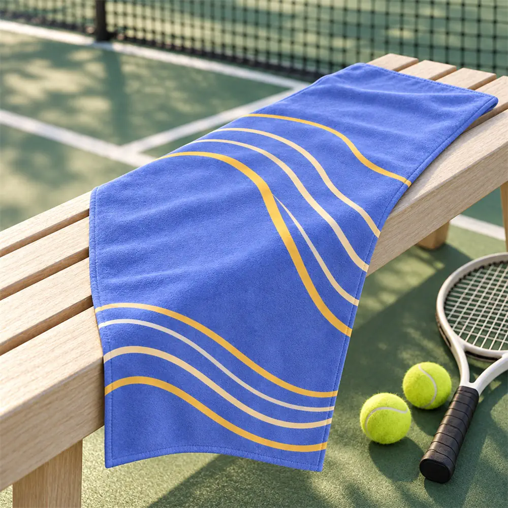 YJ-207 courtside towel concept Periwinkle contour-print microfiber sport towel on a wooden seat beside a tennis court